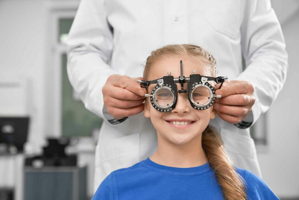girl-in-test-glasses-checking-eyesight-in-clinic-F7NVXRJ.jpg