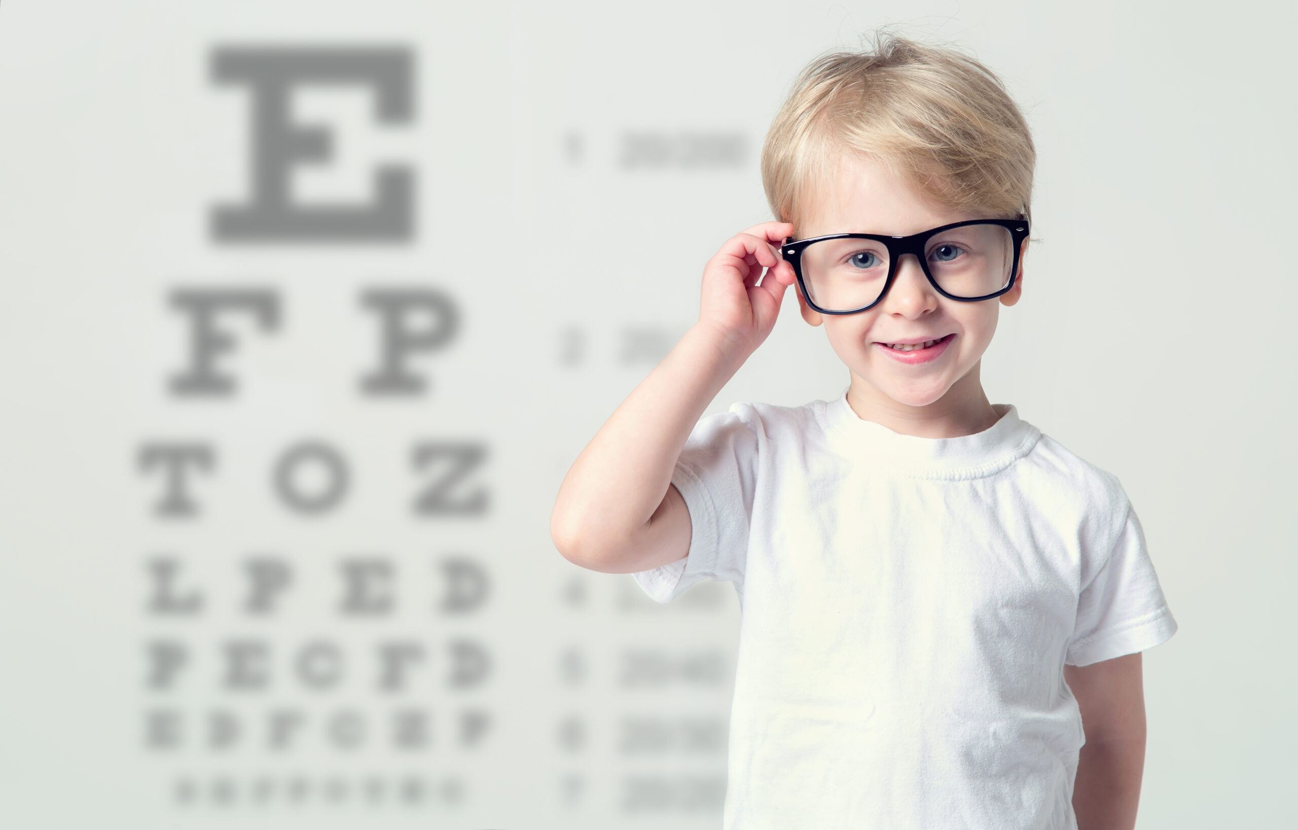 Little,Boy,In,Glasses,Having,Eye,Test.,Tables,Vision,Testing.
